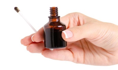 A brown bottle of iodine with a dropper. 